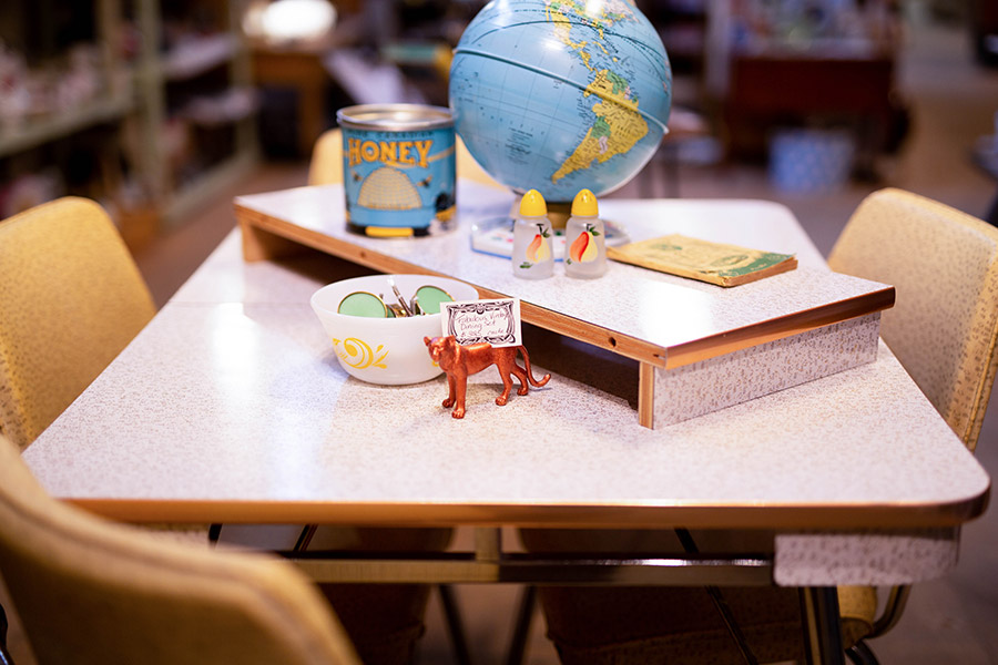 A globe and other assorted trinkets on a retro table